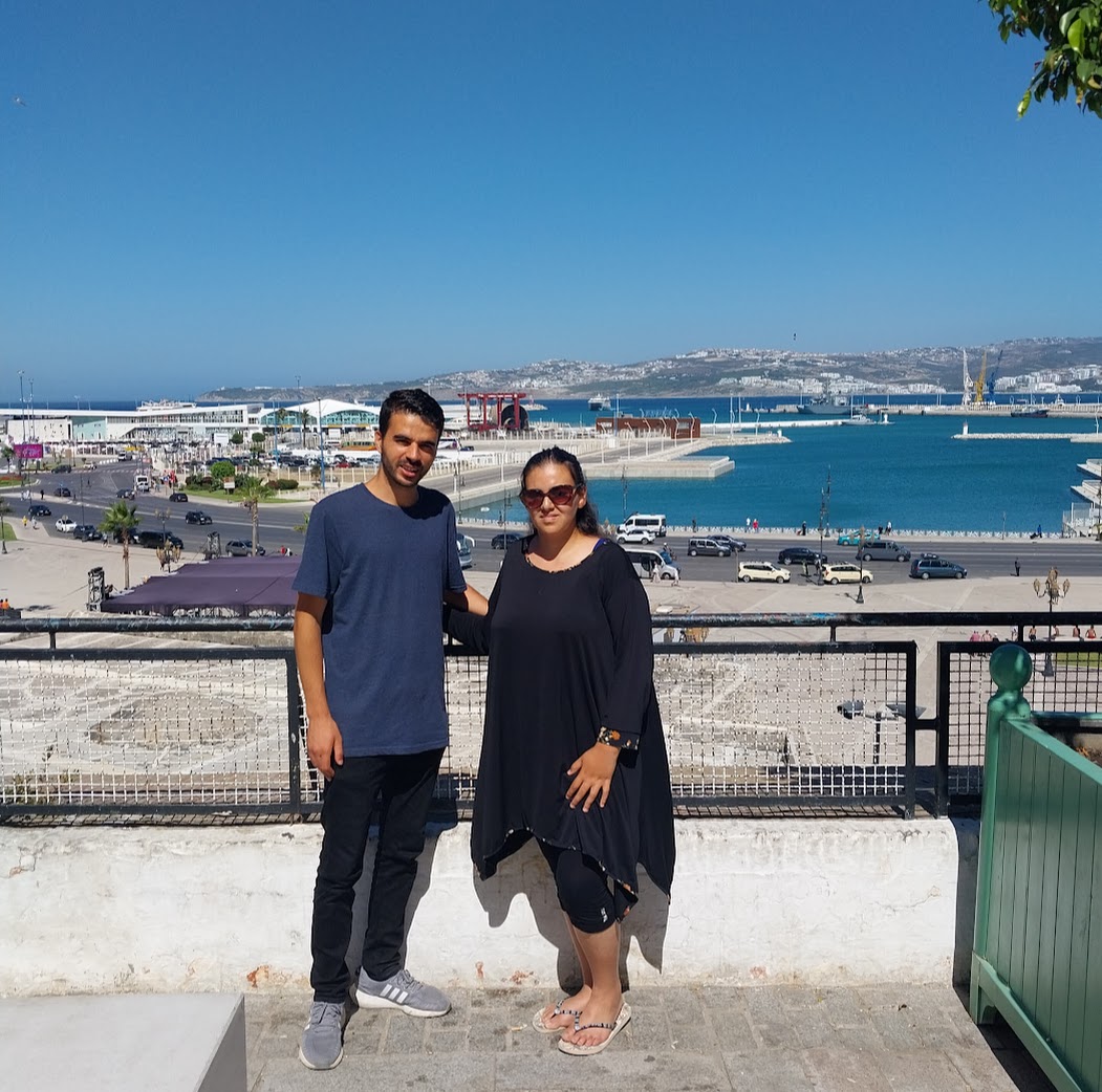 Aziz and a guest overlooking Tangier port and the Strait of Gibraltar