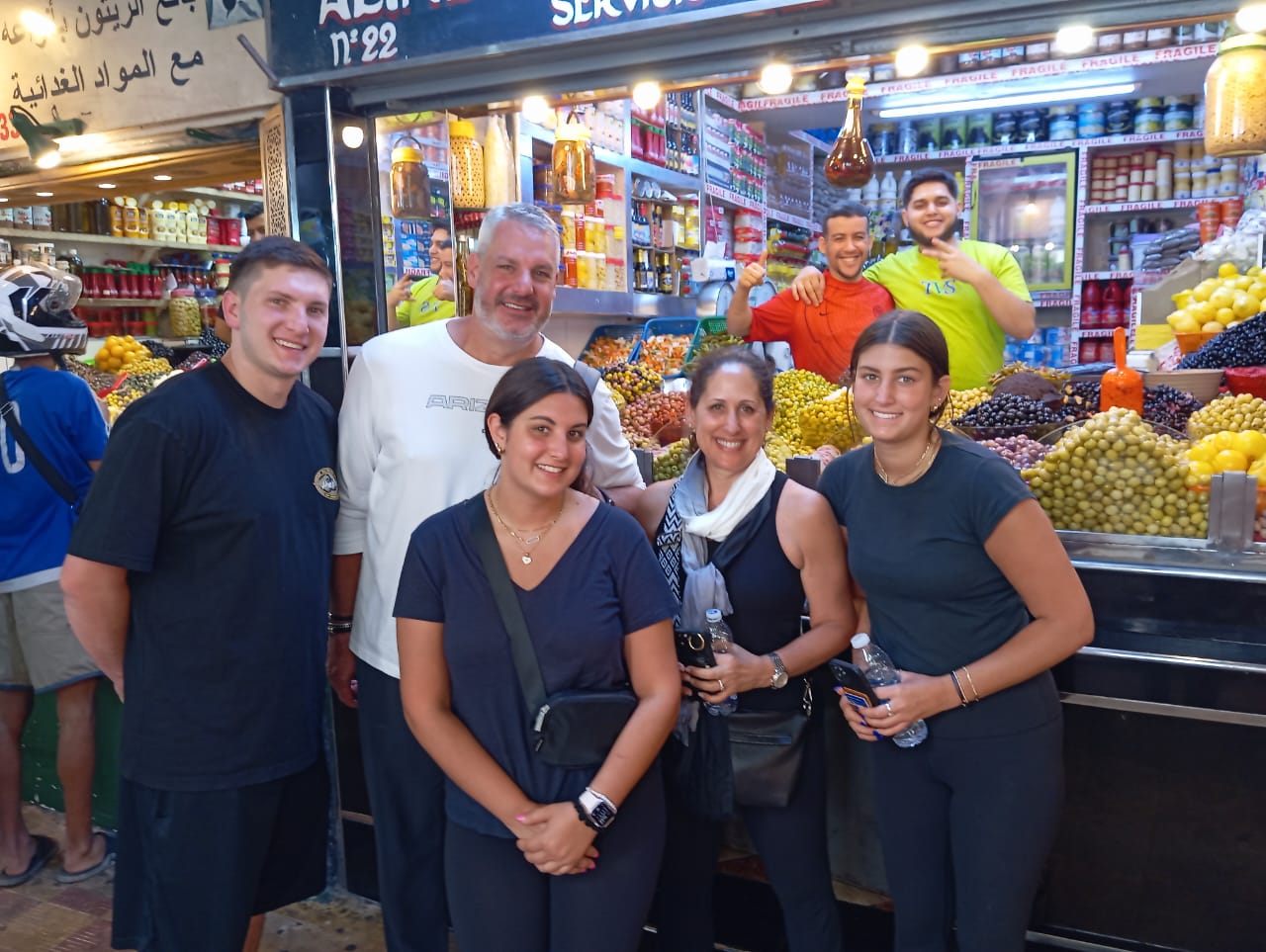 Happy family group at a Tangier olive souk on a private tour