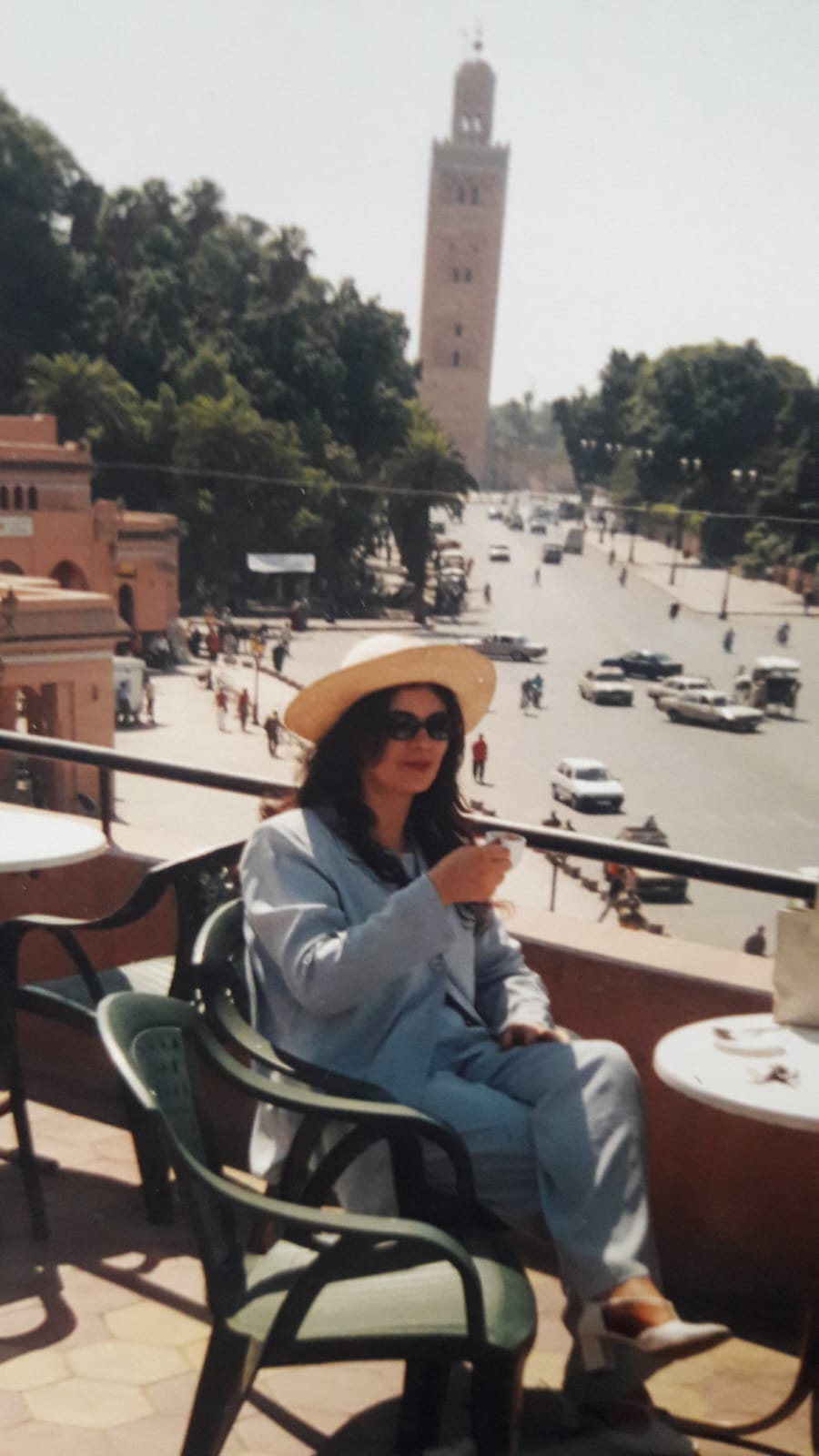 Guest at a rooftop cafe overlooking the Koutoubia Mosque in Marrakesh