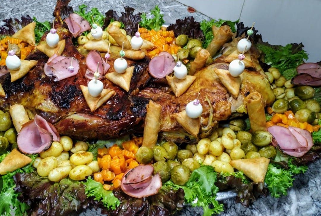 Traditional Moroccan feast spread with mechoui and pastries