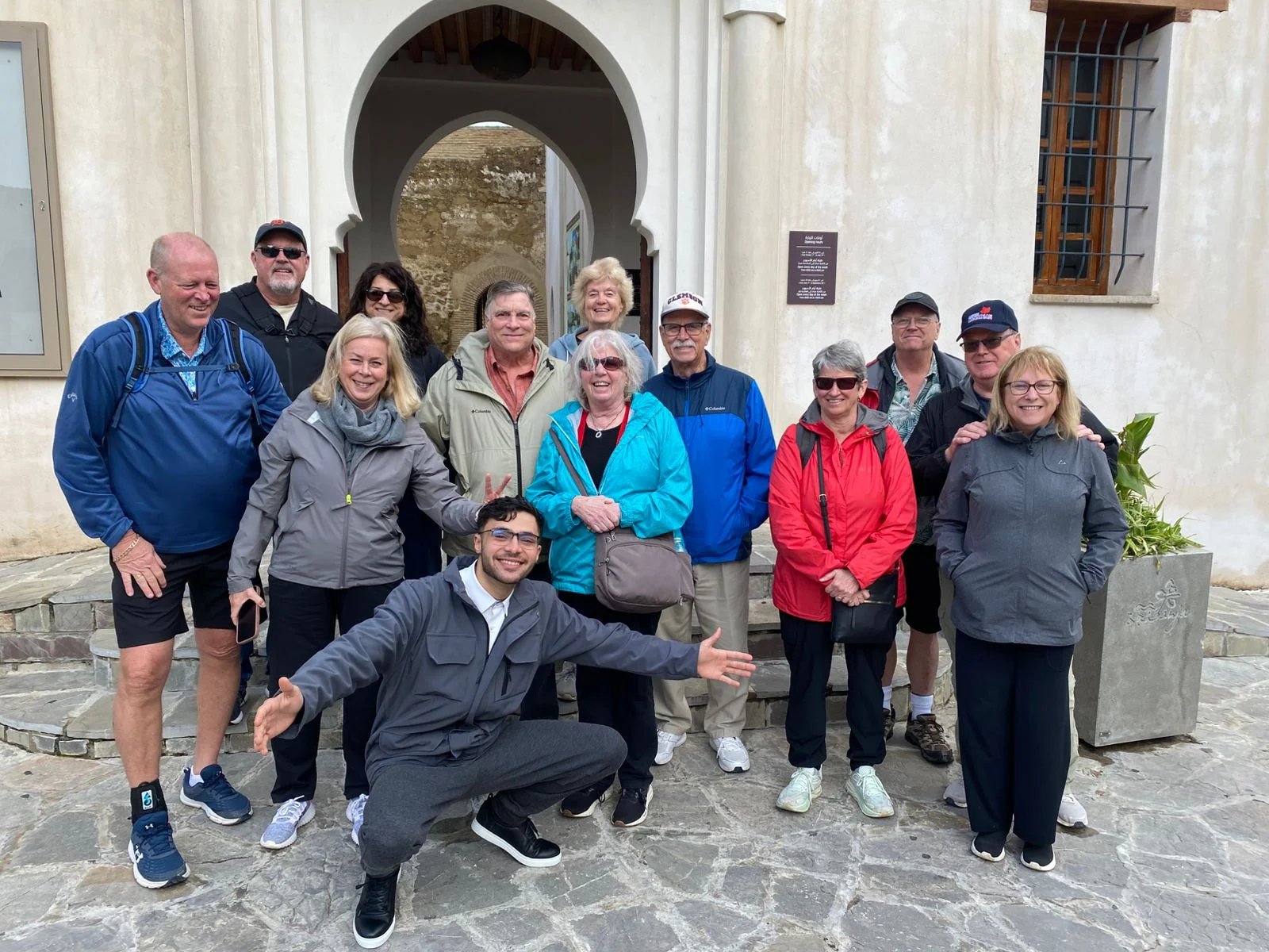 Aziz with a group of happy guests on a private tour in Morocco